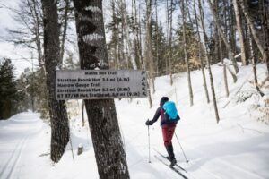 Cross country skier on the Maine Hut Trail system in winter